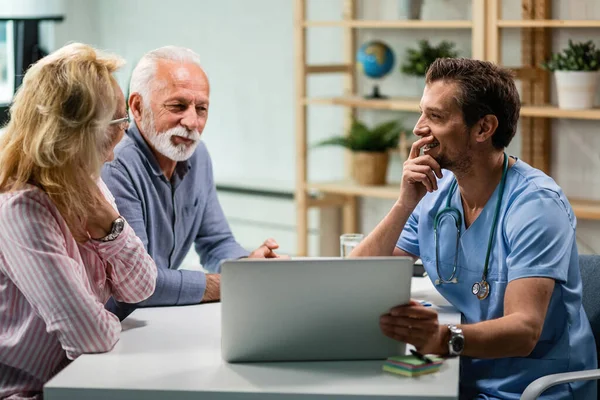 Happy Mature Couple Communicating Doctor While Using Laptop Together Focus — Fotografia de Stock