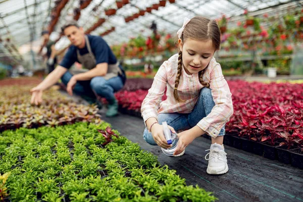 Cute Small Girl Taking Care Potted Flowers Watering Them While — Fotografia de Stock