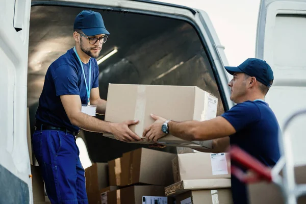 Delivery Men Loading Carboard Boxes Van While Getting Ready Shipment — Foto Stock