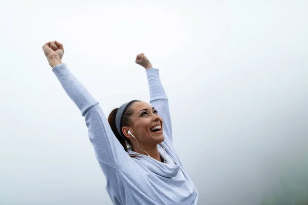 Young Happy Sportswoman Raised Arms Celebrating Success Misty Sky Copy — Stock Fotó