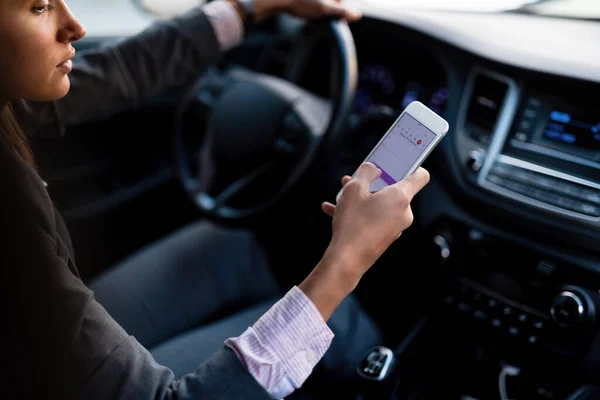 Close Businesswoman Driving Car Looking Direction Her Mobile Phone — 图库照片