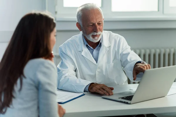 Mature Doctor His Patient Talking While Reading Medical Record Computer — Foto de Stock