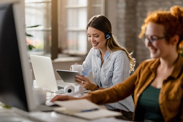 Happy Female Entrepreneur Headset Drinking Coffee While Surfing Net Touchpad — Stock Fotó