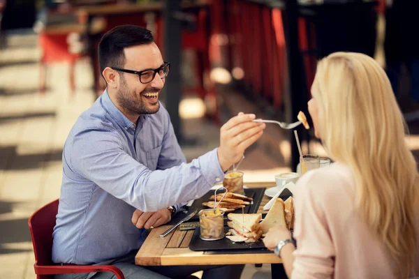 Happy Couple Eating Restaurant Man Sharing His Food Feeding His — Foto de Stock