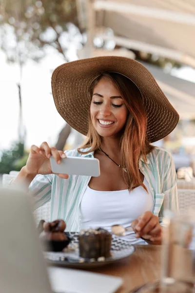 Young Smiling Woman Having Fun While Eating Chocolate Cake Using — Stockfoto