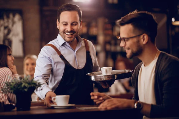 Happy Man Serving Guest Coffee While Working Part Time Waiter — Foto de Stock