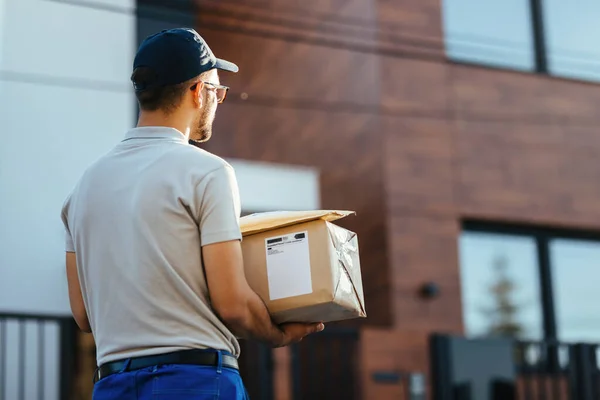 Back View Delivery Man Walking Street While Carrying Packages Delivery — Stok Foto