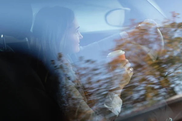 Young Businesswoman Drinking Takeaway Coffee Steering Wheel View Glass — Stockfoto