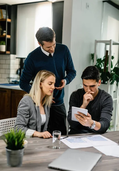 Young Couple Feeling Uncertain While Using Digital Tablet Meeting Insurance — Fotografia de Stock