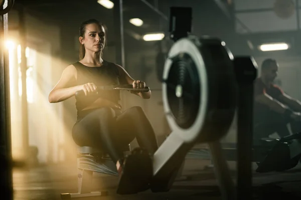 Young Athletic Woman Exercising Rowing Machine Cross Training Gym — Stockfoto