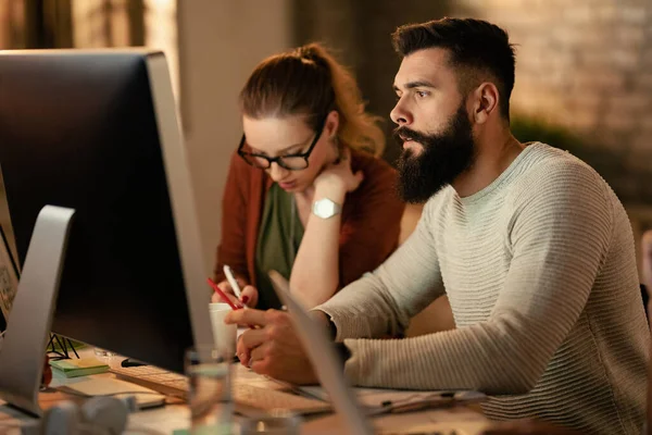 Young Entrepreneur Using Computer While Working His Colleagues Office — Foto de Stock