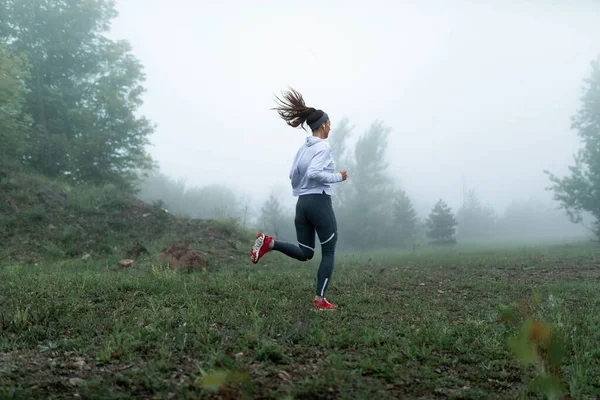 Athletic Woman Jogging Nature Foggy Morning Listening Music Earphones Copy — Stockfoto