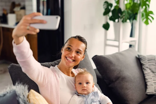 Happy Mother Her Baby Taking Selfie Smart Phone Living Room — стоковое фото