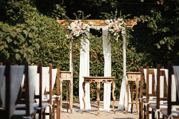 Decorated wedding aisle for marriage ceremony in a garden. 