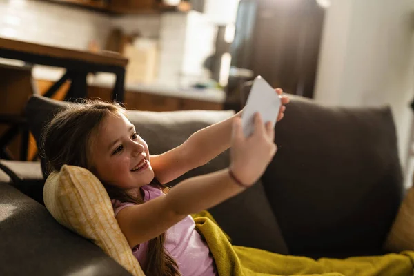 Cute Small Girl Having Fun While Using Smart Phone Taking — Stockfoto