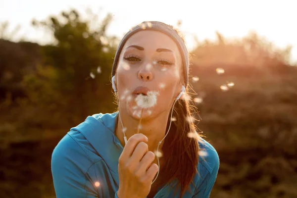 Playful Athletic Woman Having Fun While Blowing Dandelion Nature Looking — Stock Fotó