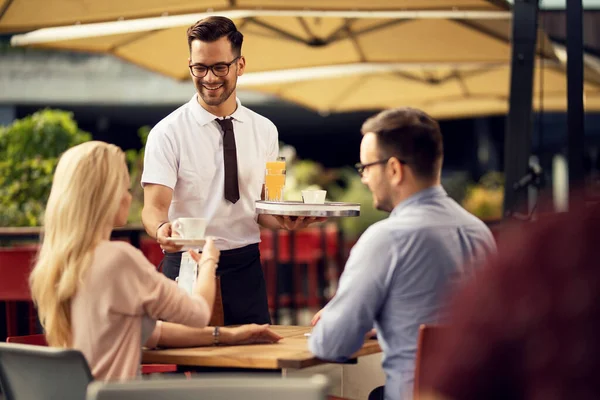 Young Happy Waiter Brining Coffee Drinks Guests Outdoor Cafe —  Fotos de Stock