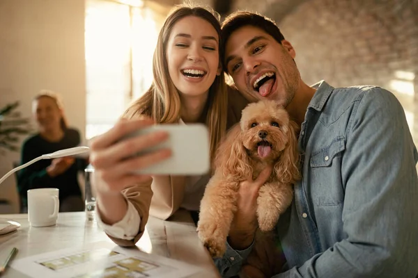 Cheerful Business Couple Having Fun Dog Taking Selfie Mobile Phone —  Fotos de Stock