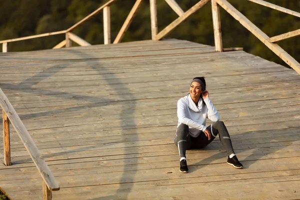 Young Happy Sportswoman Sitting Wooden Bridge Relaxing Sports Training Nature — Stock Fotó