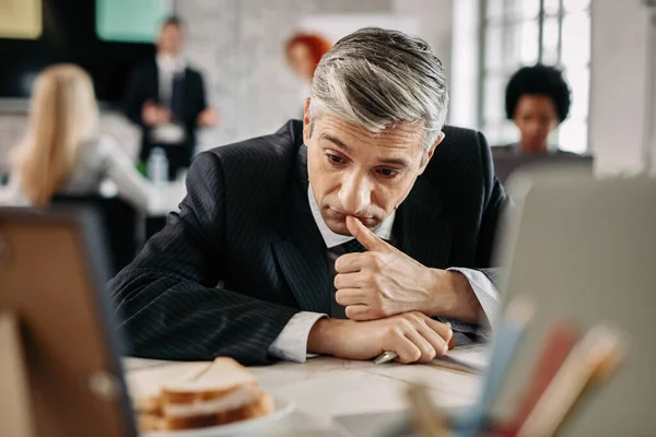 Mid Adult Businessman Contemplating While Feeling Bored Office — Foto de Stock