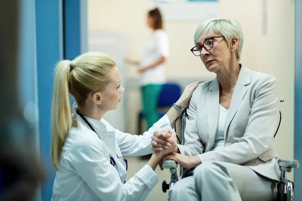 Senior Female Patient Wheelchair Feeling Worried While Communicating Female Doctor — Foto de Stock