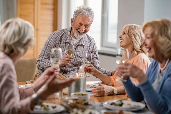 Cheerful Senior Friends Talking While Drinking Wine Eating Home Focus — Zdjęcie stockowe