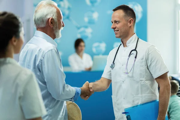 Smiling Male Doctor His Mature Patient Shaking Hands While Standing — 图库照片