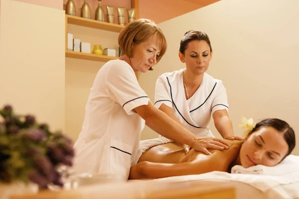 Serene Woman Getting Back Massage Two Therapists Spa Treatment — Stok Foto