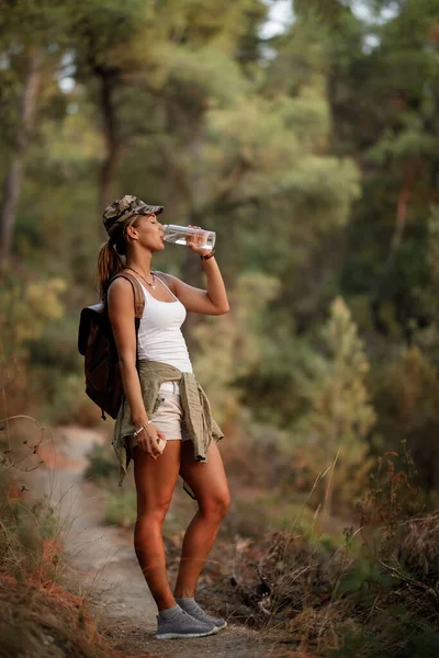 Full Length Female Hiker Drinking Water While Standing Footpath Forest — Stock Photo, Image