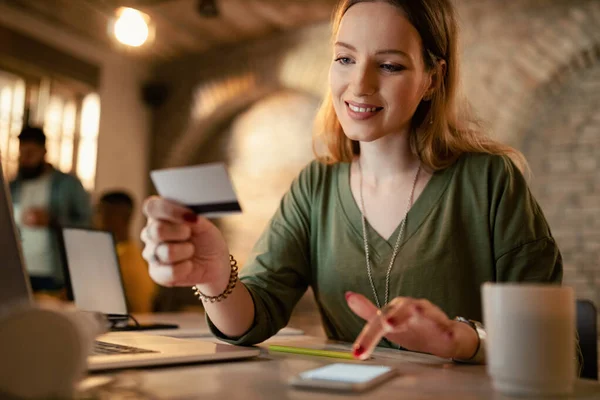 Smiling Female Entrepreneur Banking Credit Card Mobile Phone While Working — Foto de Stock