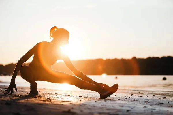 Athletic Woman Doing Stretching Exercises While Working Out River Sunrise — ストック写真