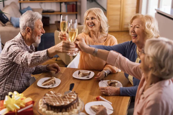 Happy Senior People Having Fun While Celebrating Birthday Toasting Champagne — стоковое фото