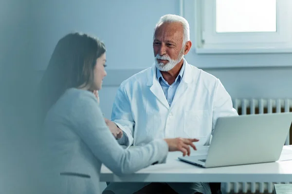 Happy Mature Doctor His Patient Communicating While Reading Medical Records — Fotografia de Stock