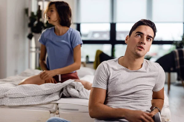 Displeased Man Sitting Bed Thinking Relationship Problems Fight His Girlfriend — 스톡 사진