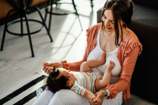 Smiling Mother Bonding Her Baby Daughter Holding Hands Home — Foto de Stock