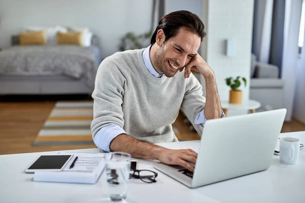Young Happy Freelance Worker Surfing Net Computer While Working Home — Stockfoto