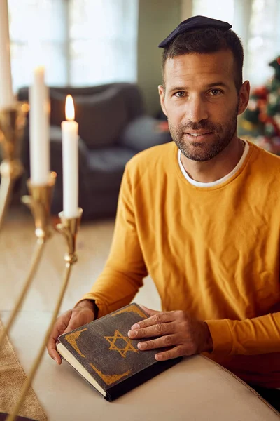 Portrait Man Wearing Yarmulke Reading Tanakh While Celebrating Hanukkah Home — Stock Fotó