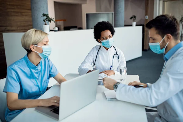 African American Doctor Her Colleagues Wearing Face Masks Talking Meeting — 스톡 사진
