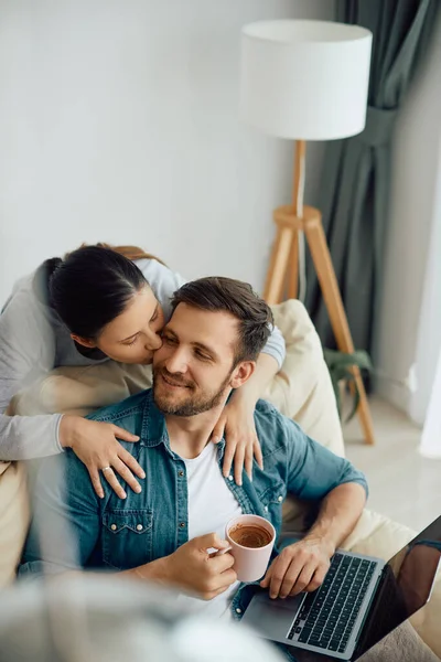 Smiling Man Surfing Net Laptop Drinking Coffee While His Wife —  Fotos de Stock