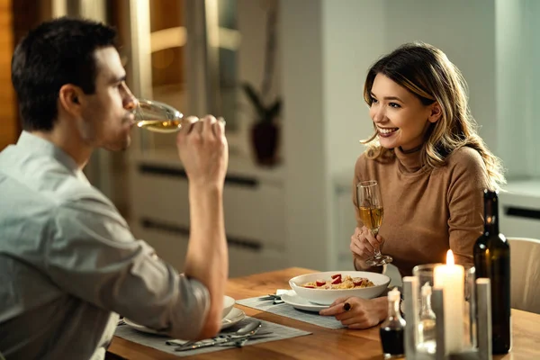 Happy Woman Talking Her Boyfriend While Drinking Champagne Eating Dinner — стоковое фото