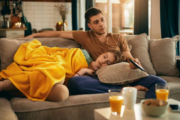 Young Woman Napping While Her Boyfriend Watching Home — Foto Stock