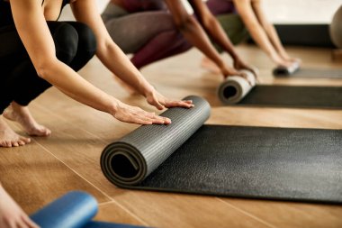 Close-up of female athletes preparing for sports training at exercise club.