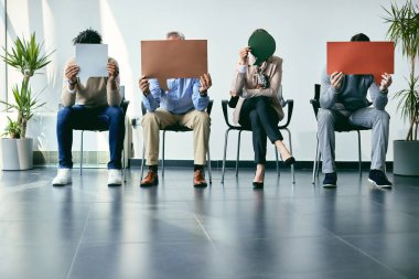 Job candidates holding speech bubbles while waiting for job interview. Copy space.