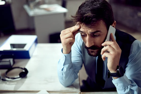 Young Worried Businessman Talking Mobile Phone While Working Office — Photo