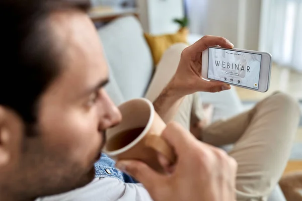 Close Man Using Smart Phone Webinar While Drinking Coffee Home — 图库照片