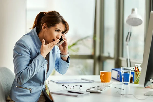 Young Businesswoman Coughing While Communicating Mobile Phone Office — стоковое фото