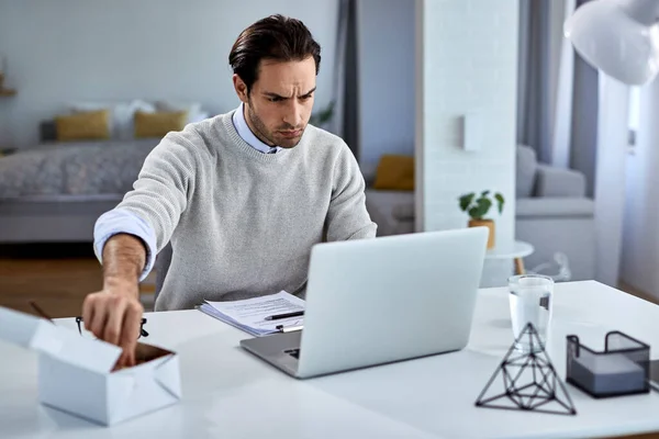 Young Businessman Reading Mail Computer Eating While Working Home — Stockfoto