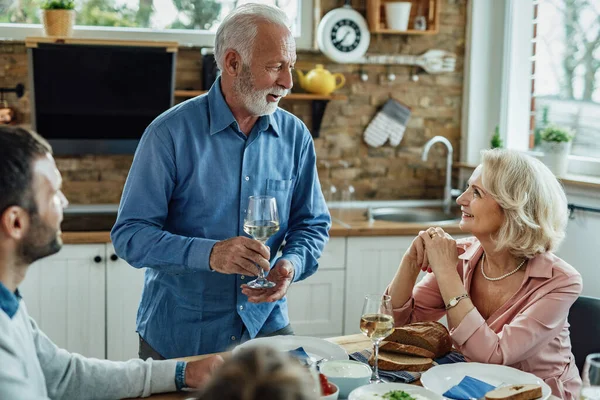 Happy Senior Man Proposing Toast While Having Lunch His Family — Stock Fotó