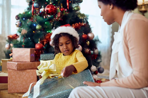 African American Mother Daughter Enjoying Opening Gifts Christmas Day Home — Foto de Stock