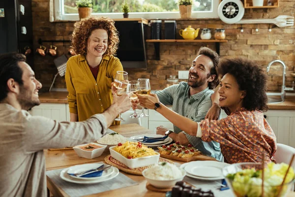 Group Carefree Friends Toasting Wineglasses While Having Lunch Home — Φωτογραφία Αρχείου